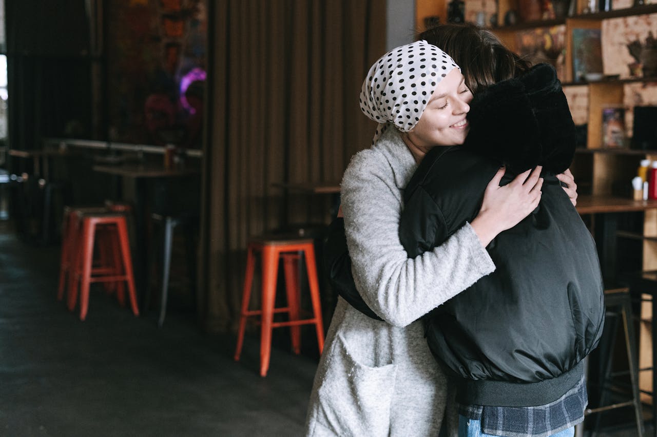 why-choose-us Two individuals sharing an embracing moment, symbolizing support and care.